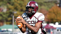 Reid holding the football during a game